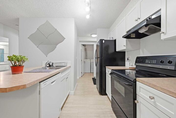 Property Photo:  5555 Falsbridge Drive NE 111  AB T3J 3E8 
