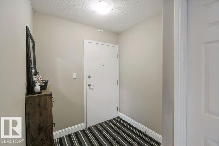 Property Photo:  13005 140 Avenue NW 212  AB T6V 1X1 