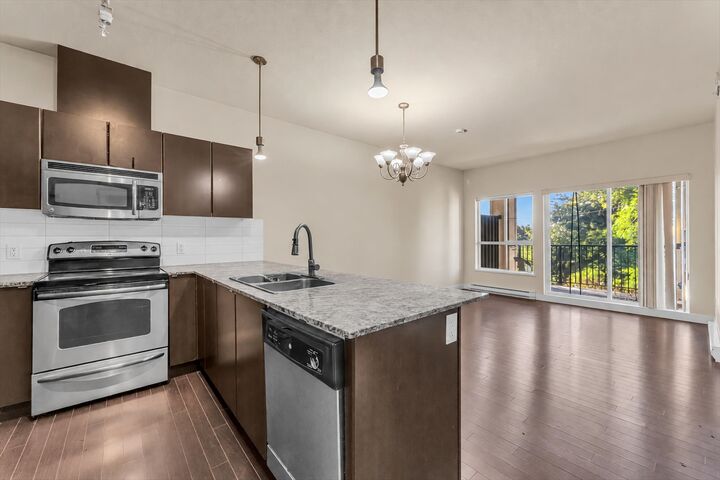 Property Photo:  9655 King George Boulevard 409  BC V3T 0C7 