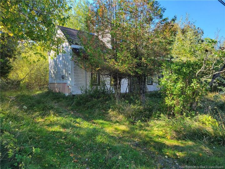 Property Photo:  663 Bay Street  NB E2M 7L6 