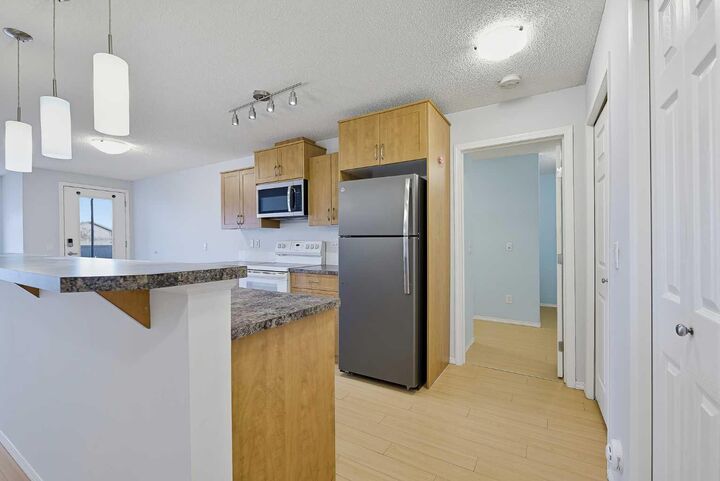 Property Photo:  700 Willowbrook Road NW 2105  AB T2R 0E5 