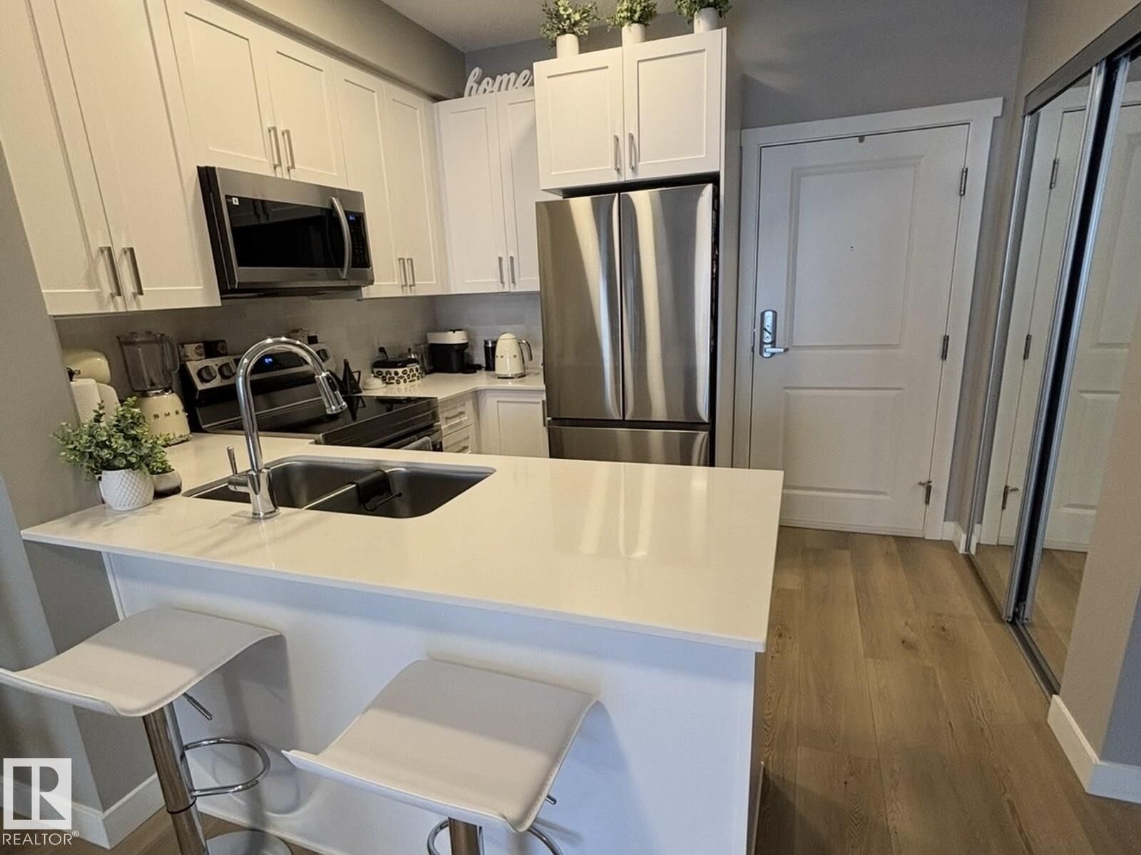 Property Photo:  12804 140 Ave NW NW 318  AB T6V 0M3 